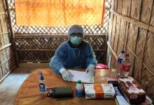 A doctor being supported by Christian Aid in the Rohingya refugee camps in Cox's Bazar, Bangladesh, waits for his next patient. Image: Christian Aid/Dhaka Ahsania Mission
